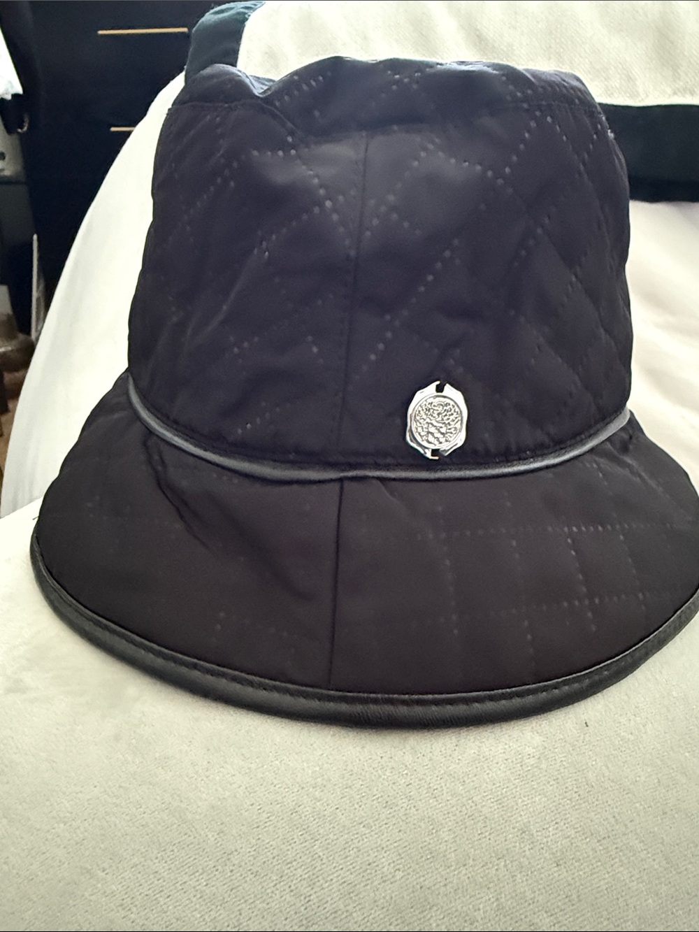Vince Camuto Quilted Black Bucket Hat with Silver Medallion